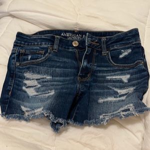 American Eagle distressed blue midi shorts